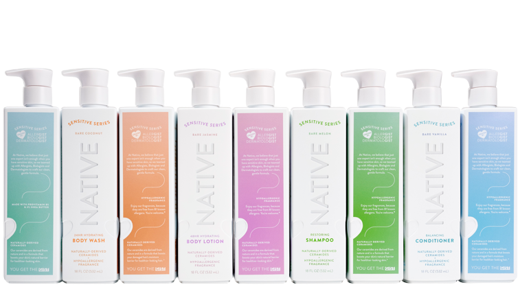 Native brand products from the Sensitive Series are arranged on a white background. They are directly next to one another and there are nine total bottles. In an alternating pattern the bottles are either to the side with product information facing forward, or the front with the brand logo facing forward.